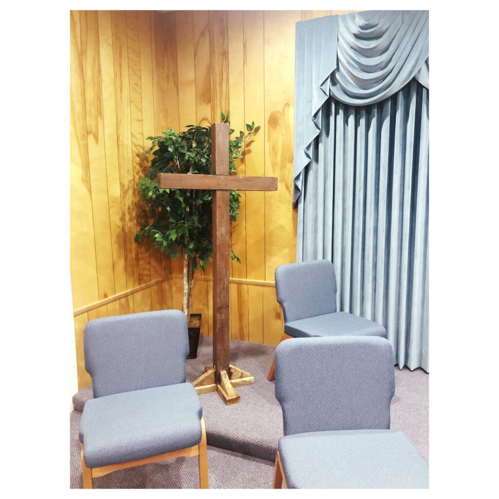 Photo of wooden cross at Woodrow Baptist Church